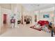Bright living room featuring a fireplace, tile flooring, and access to other rooms at 1441 Olde Kensington Ln, Deltona, FL 32725