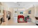 Bright living room with fireplace and seamless access to other rooms via tall doorways at 1441 Olde Kensington Ln, Deltona, FL 32725