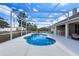 Lovely screened-in pool with plenty of room for entertaining in the lanai at 1441 Olde Kensington Ln, Deltona, FL 32725