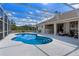 Inviting screened-in pool with built-in steps and adjacent outdoor bar at 1441 Olde Kensington Ln, Deltona, FL 32725