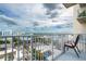 Balcony with open air, overlooking city landscape under bright sky and puffy clouds at 155 S Court Ave # 1305, Orlando, FL 32801