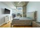 Stylish bedroom boasting a sleek TV, city view, and contemporary furnishings for ultimate relaxation at 155 S Court Ave # 1305, Orlando, FL 32801