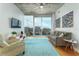 Well-lit living room with modern decor, a comfy couch, and a fantastic city view at 155 S Court Ave # 1305, Orlando, FL 32801