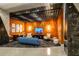 Stylish lounge area with unique lighting, comfortable seating, and a TV at 155 S Court Ave # 1305, Orlando, FL 32801