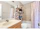 Cozy bathroom featuring a tiled shower/tub combo, vanity, and a mirrored medicine cabinet at 1612 Sandy Point Sq # 56, Orlando, FL 32807