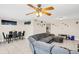 Open-concept living space with a sectional sofa, dining area, and ample natural light at 1612 Sandy Point Sq # 56, Orlando, FL 32807