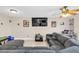 Relaxing living room with a sectional sofa, large TV, and neutral decor at 1612 Sandy Point Sq # 56, Orlando, FL 32807