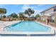 Enjoy the outdoors in this spacious pool area with ample seating and a tranquil environment, perfect for relaxation and recreation at 1612 Sandy Point Sq # 56, Orlando, FL 32807