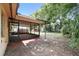 A large fenced yard with a covered patio at 17 W Nightingale St, Apopka, FL 32712