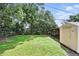 Backyard with a green lawn and a storage shed at 17 W Nightingale St, Apopka, FL 32712