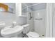 Full bathroom with a shower, toilet, and sink, featuring a wall-mounted mirrored cabinet at 17 W Nightingale St, Apopka, FL 32712