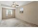 Simple bedroom featuring a ceiling fan and window air conditioner at 17 W Nightingale St, Apopka, FL 32712