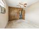 Bedroom with ceiling fan, AC unit, and access to another room at 17 W Nightingale St, Apopka, FL 32712