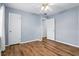 Cozy bedroom features wood floors, neutral paint, and ample natural light at 17 W Nightingale St, Apopka, FL 32712