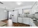 Bright kitchen boasts modern appliances, granite countertops, and access to the patio at 17 W Nightingale St, Apopka, FL 32712