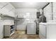 Laundry room with washer, dryer, shelving and storage at 17 W Nightingale St, Apopka, FL 32712