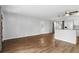 Spacious living space with laminate flooring and kitchen access at 17 W Nightingale St, Apopka, FL 32712