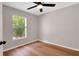 Bedroom featuring wood-look flooring and natural light at 1861 E Glancy Dr, Deltona, FL 32725