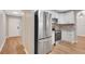 Modern kitchen featuring stainless steel appliances, granite countertops, and ample storage space at 1861 E Glancy Dr, Deltona, FL 32725