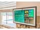 The kitchen is equipped with a smart hub, overlooking a pool, complemented by modern design and fixtures at 1861 E Glancy Dr, Deltona, FL 32725