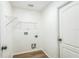 Functional laundry room with overhead shelving and connections for a washer and dryer at 1861 E Glancy Dr, Deltona, FL 32725