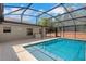 A refreshing private screened-in pool with clear blue water at 1861 E Glancy Dr, Deltona, FL 32725
