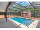 A serene private screened-in pool with a storage building at 1861 E Glancy Dr, Deltona, FL 32725