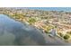 Panoramic aerial view showcasing waterfront homes with private docks along a picturesque bay at 2384 John Anderson Dr, Ormond Beach, FL 32176