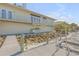Waterfront home featuring a patio with an outdoor kitchen and a wooden dock, perfect for waterfront entertainment at 2384 John Anderson Dr, Ormond Beach, FL 32176