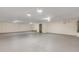 Unfinished basement with neutral paint, concrete floors, and overhead lighting is perfect for storage or recreation space at 2384 John Anderson Dr, Ormond Beach, FL 32176