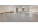 Spacious unfinished basement area is ready for your personal touches with concrete floors and neutral paint at 2384 John Anderson Dr, Ormond Beach, FL 32176