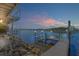 Waterfront dock at sunset with expansive views of the intercoastal waterway at 2384 John Anderson Dr, Ormond Beach, FL 32176