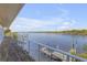 Deck with water views featuring a dock with a boat lift at 2384 John Anderson Dr, Ormond Beach, FL 32176