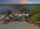 Exterior front elevation of home with landscaping and waterfront view at 2384 John Anderson Dr, Ormond Beach, FL 32176