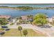Street view of waterfront home with mature landscaping, a dock, and beautiful water views at 2384 John Anderson Dr, Ormond Beach, FL 32176