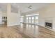 Bright, open living room with fireplace and french doors leading to water views at 2384 John Anderson Dr, Ormond Beach, FL 32176
