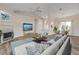 Bright living room with vaulted ceilings, modern furniture, and a fireplace, creating a cozy atmosphere at 2384 John Anderson Dr, Ormond Beach, FL 32176