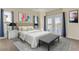 Beautifully staged main bedroom with water views, a bed, side tables and bench at 2384 John Anderson Dr, Ormond Beach, FL 32176