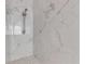 Luxurious walk-in shower with marble tile and chrome fixtures at 2384 John Anderson Dr, Ormond Beach, FL 32176