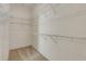 Spacious walk-in closet featuring carpet flooring, wire shelving, and plenty of storage space at 2384 John Anderson Dr, Ormond Beach, FL 32176