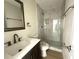 Remodeled bathroom with tiled shower, new vanity, and fixtures at 2514 Highlawn Ave, Sanford, FL 32773