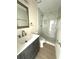 Updated bathroom with a modern vanity, toilet, and a glass-enclosed shower with stylish tile at 2514 Highlawn Ave, Sanford, FL 32773