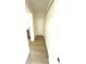Hallway with light wood floors leads to kitchen at 2514 Highlawn Ave, Sanford, FL 32773