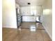 Well-lit kitchen featuring stainless steel appliances, white cabinetry, and a decorative tile border at 2514 Highlawn Ave, Sanford, FL 32773