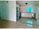 Modern kitchen with stainless steel appliances and sleek, white cabinets at 2514 Highlawn Ave, Sanford, FL 32773