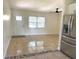 Bright living room with tile flooring and natural light complemented by a stainless steel refrigerator at 2514 Highlawn Ave, Sanford, FL 32773