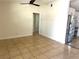 Open-concept area with tile flooring, a ceiling fan, and seamless transition to the updated kitchen at 2514 Highlawn Ave, Sanford, FL 32773