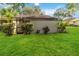 Well-maintained backyard with lush green lawn and enclosed patio, great for outdoor entertaining at 262 W Sabal Palm Pl, Longwood, FL 32779