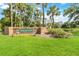 Sabal Point community sign, with landscaping and a serene lake view at 262 W Sabal Palm Pl, Longwood, FL 32779