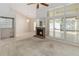 Open-concept living room featuring a brick fireplace and lots of natural light at 262 W Sabal Palm Pl, Longwood, FL 32779